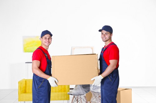 Loading household items into a van for removal