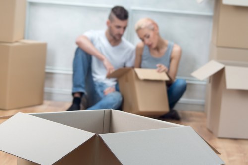 Team member using safe lifting technique during a move