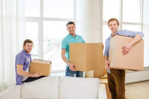 Removal team handling packing and furniture transport for a home move in West London