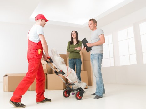 Local removals team handling access on a residential Ealing street