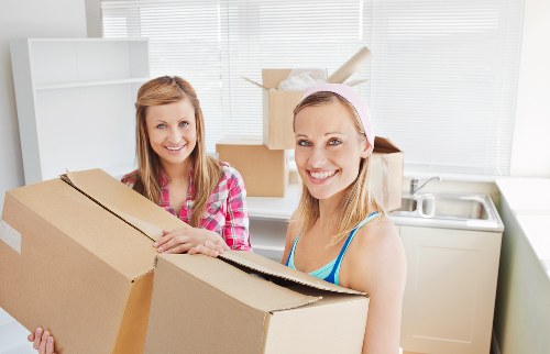Careful wrapping and labelling of belongings for moving day
