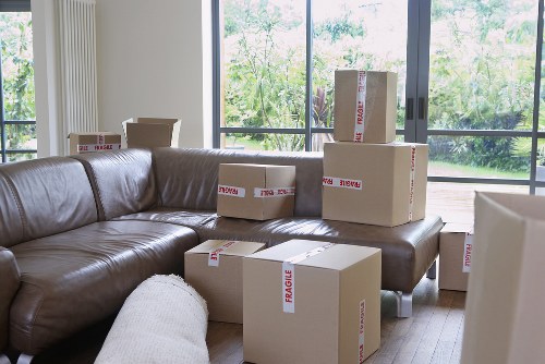 Professional movers handling desks and office equipment in Ealing